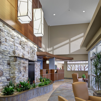 The hospital lobby offers a comfortable place to wait with the Caring Hearts Gift Shop close by.