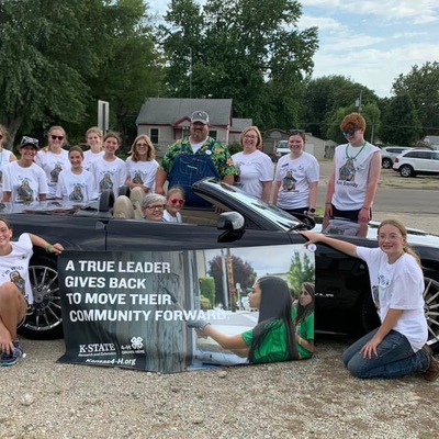 Leadership SQUAD members accompany parade marshal (Aunt) Sandy Abeldt in the CKFF parade