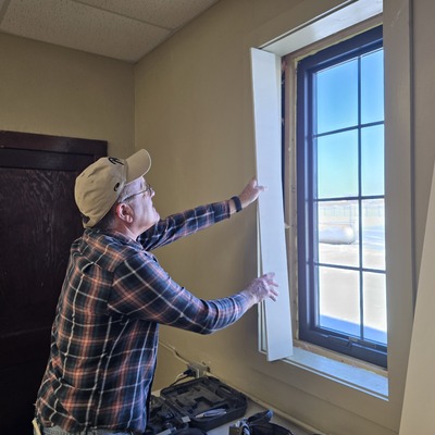 Brian Lady installing new dining room windows in 2025.