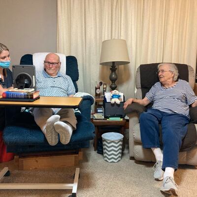 Melissa Peterson RN, Clinical Manager, visits with patient.